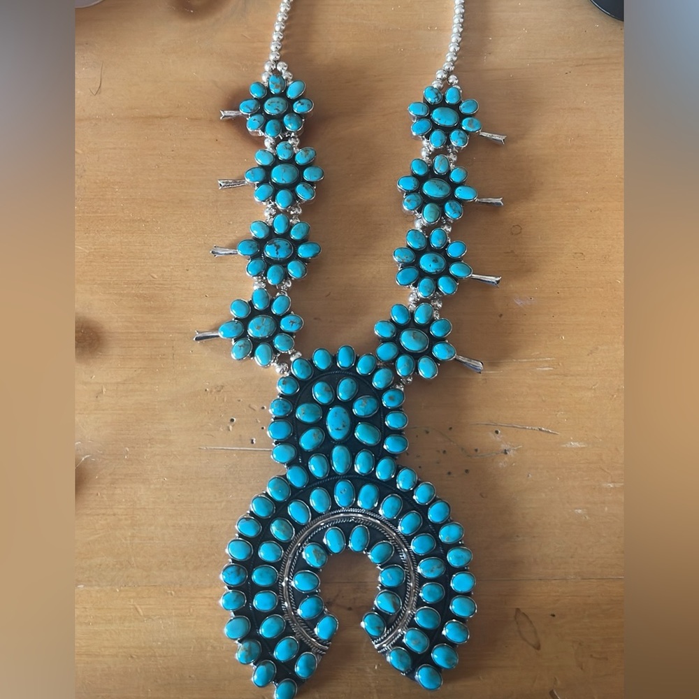 Turquoise, sterling silver squash blossom.